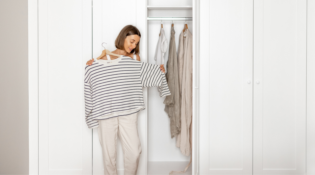 Woman looking through wardrobe closet